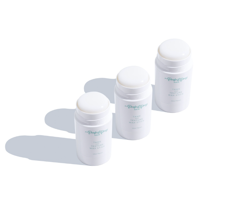 Three sticks of hair wax in white containers, arranged horizontally in a triple pack formation on a white background.