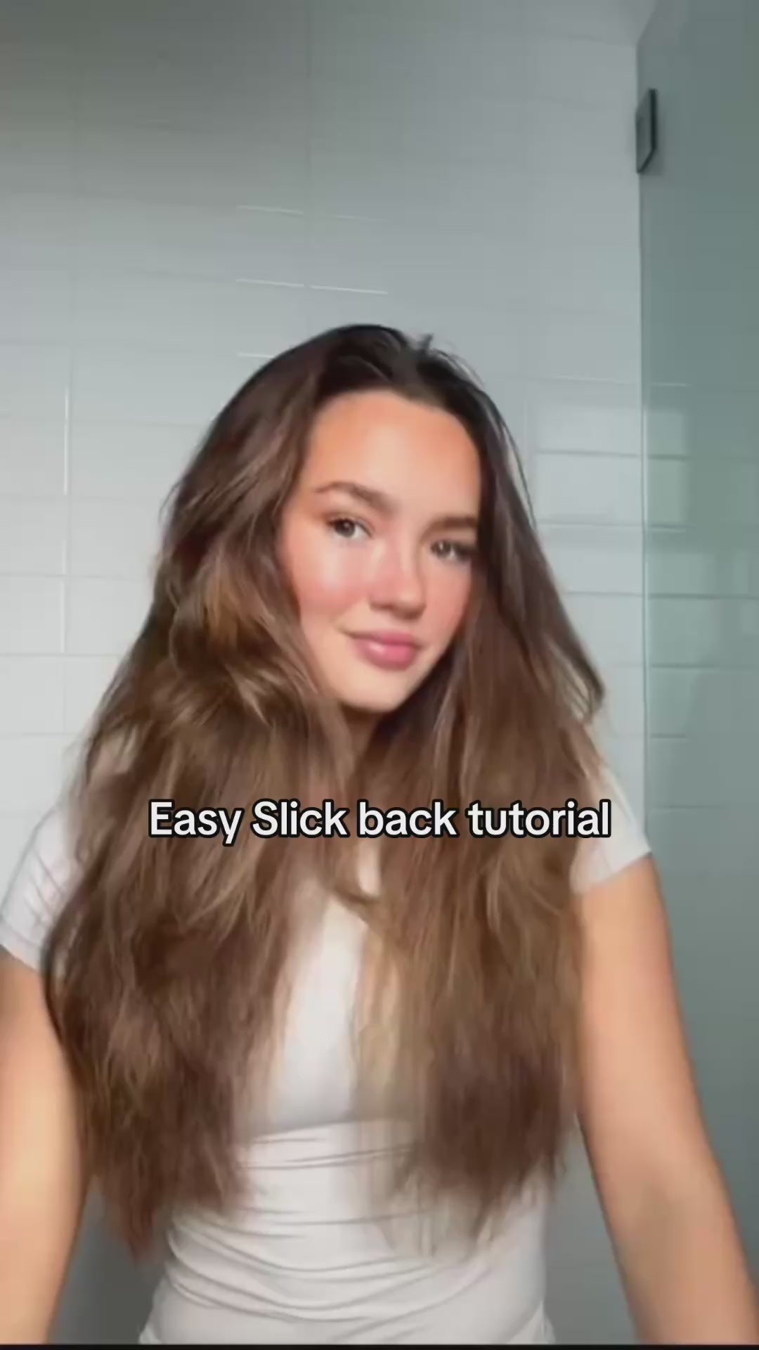 Load video: Slick back tutorial using wax stick for taming flyaways. Gigi Hubber
